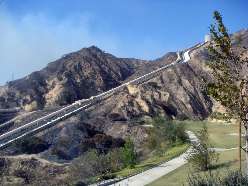 A thumbnail of an aqueduct flowing downhill near a developed area that provides more information on the topic Energy used to provide water 
